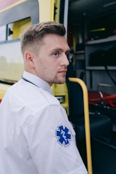 Portrait of a paramedic standing by an ambulance, emphasizing readiness and professionalism.
