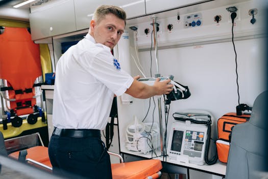 A paramedic examines medical equipment inside an ambulance, focusing on emergency preparedness.