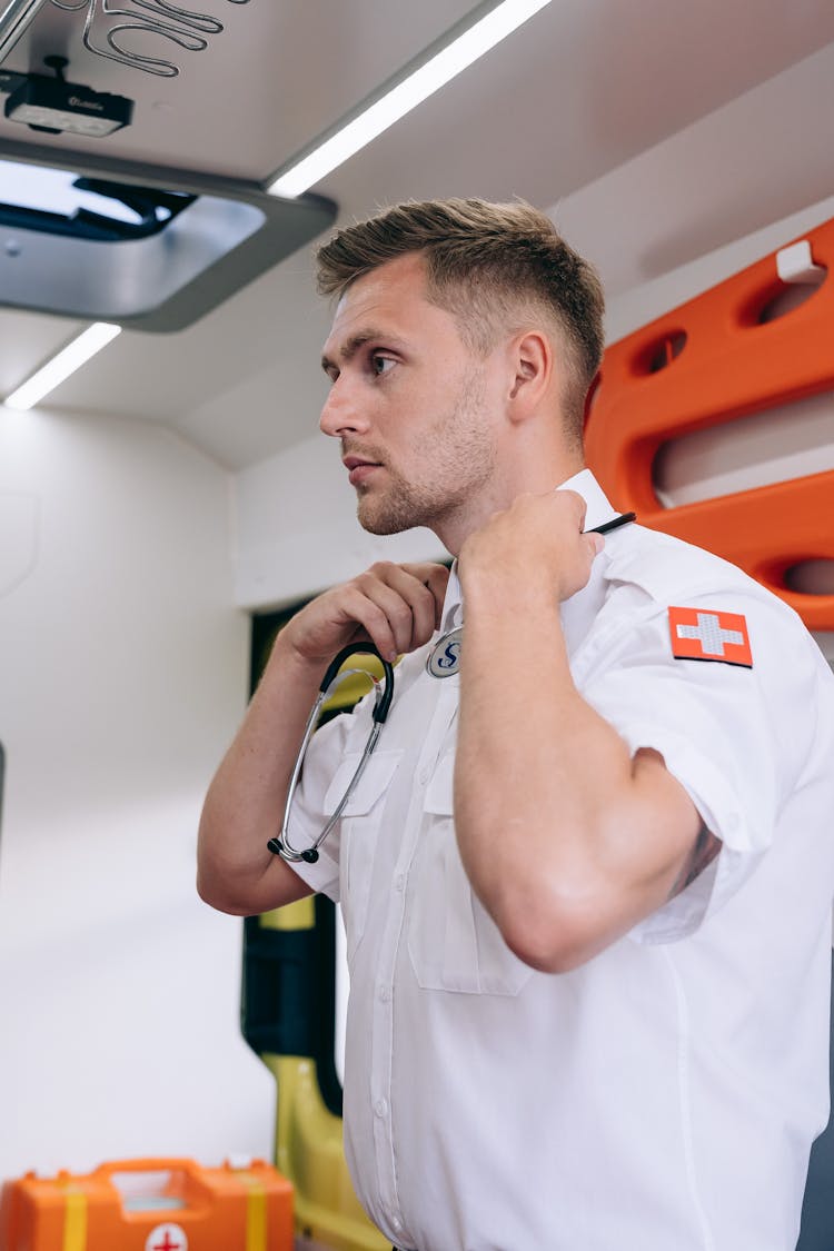 A Male Paramedic Inside An Ambulance