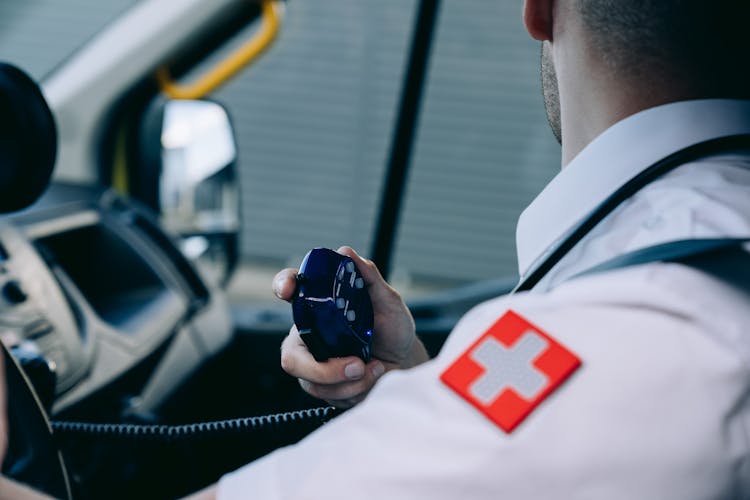 A Paramedic Holding A Radio