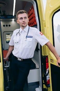 Professional paramedic with stethoscope by an ambulance, ready for action.