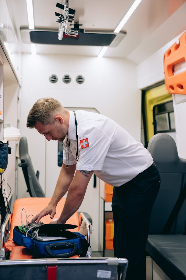 A Paramedic Preparing An Emergency Bag