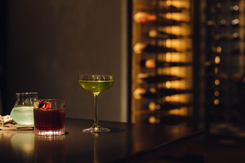 Free A variety of colorful cocktails on a bar table in a dimly lit setting, exuding luxury and sophistication. Stock Photo