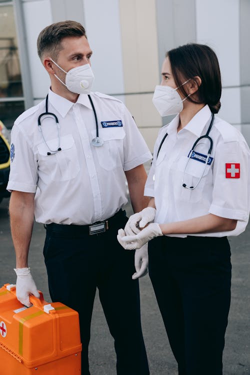 Man and Woman Wearing Face Masks