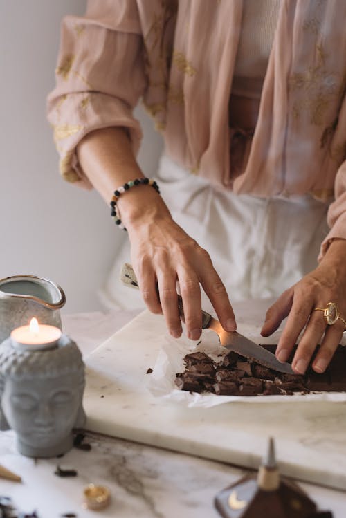 Person Slicing Chocolate with a Knofe