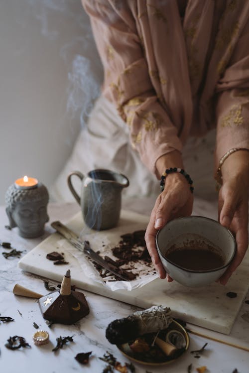 Person Holding a Ceramic Bowl