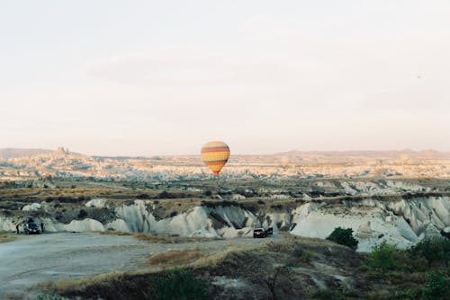 Free A Hot Air Balloon on Top of Rock Formations Stock Photo