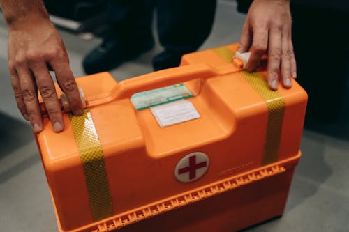 Free A Person Holding a First Aid Kit Stock Photo
