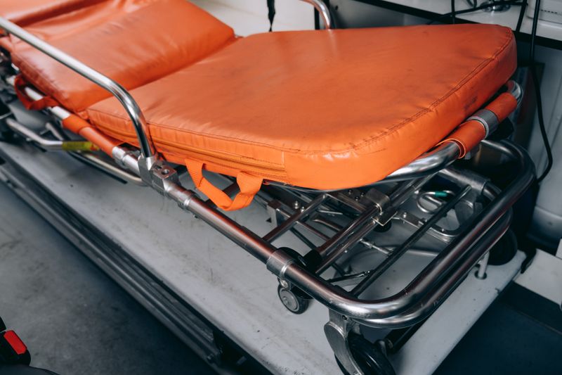 Close-up of an emergency medical stretcher used for patient transport