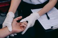 Person Holding White Printer Paper