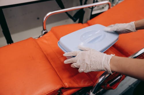 Lifeguard Holding a Rescue Box in Ambulance 