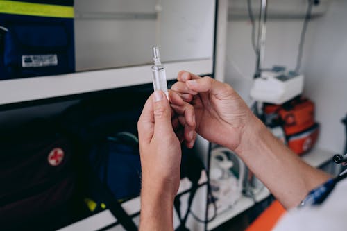 Medic Holding a Syringe 