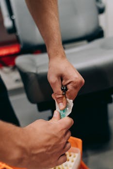 Close-up of a healthcare worker preparing an injection in a medical setting.
