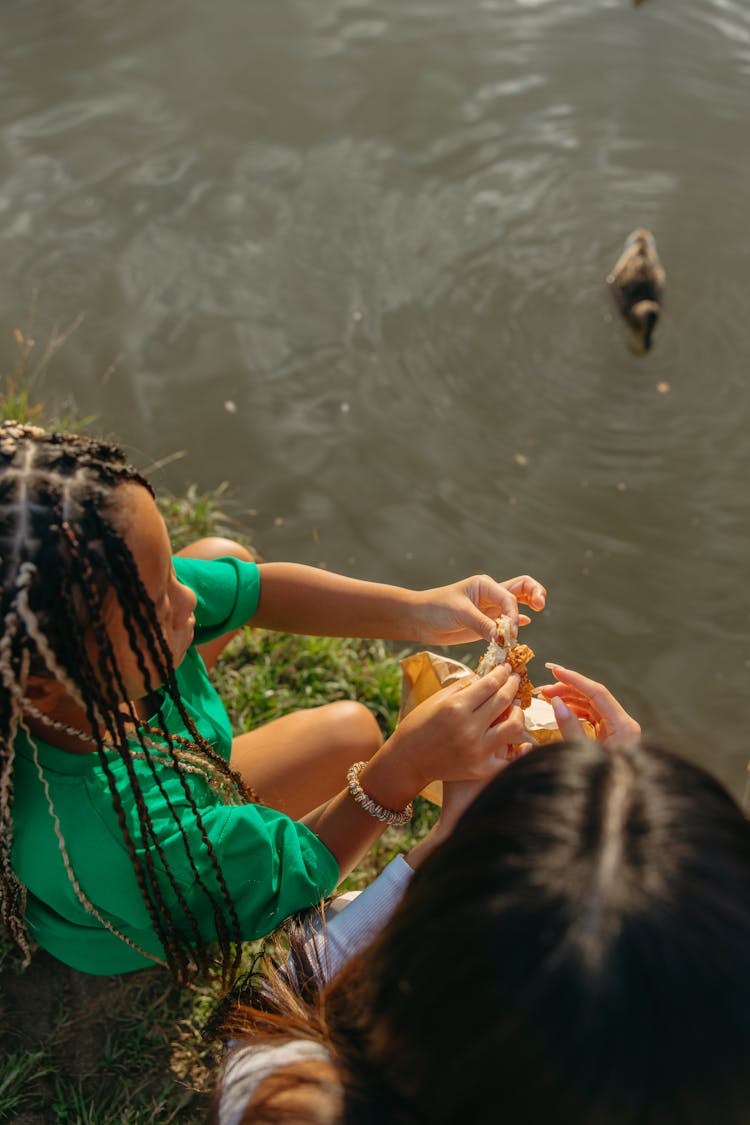 High-Angle Shot Of A Girl Getting Bread