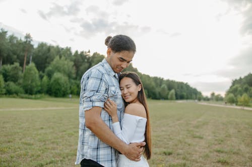 Free A Woman Resting Her Head on a Man's Chest Stock Photo