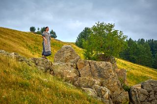 Figure on a grassy hillside — Bulat Khamitov on Pexels