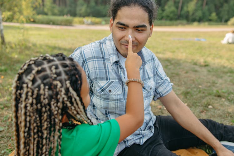 Girl Touching The Nose Of A Man