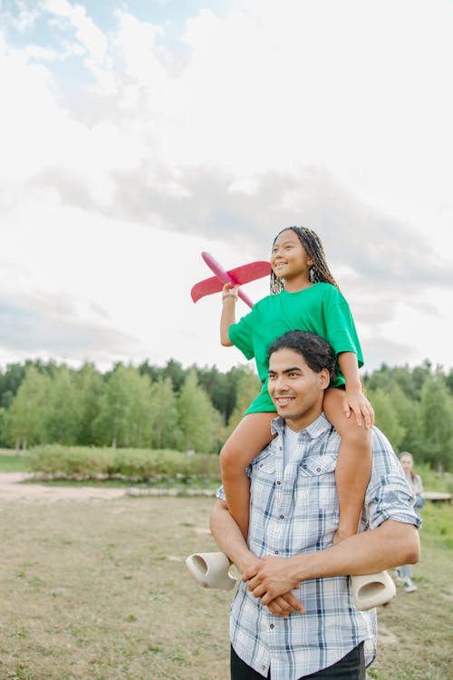Free A Girl on His Father's Shoulder Stock Photo