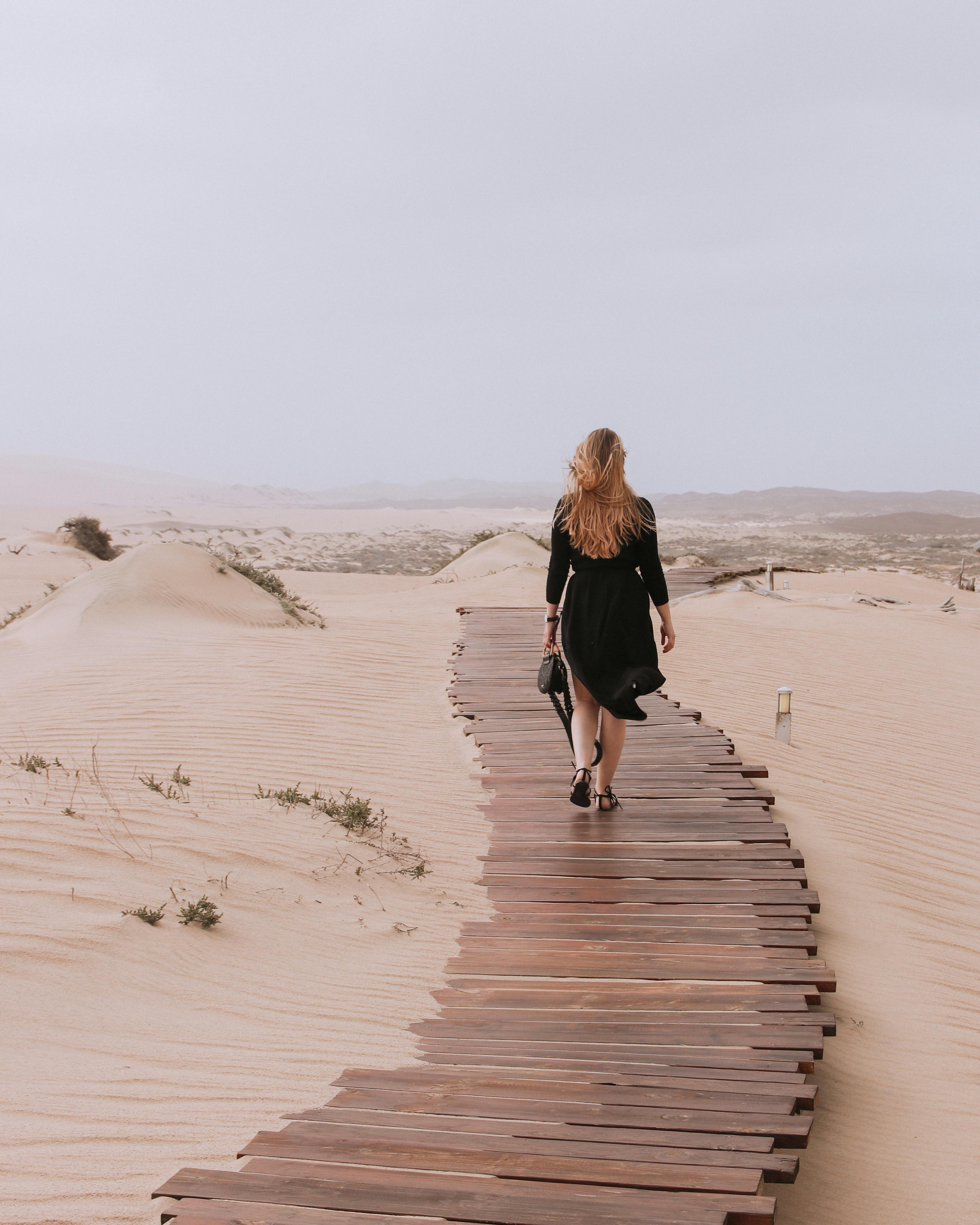 woman walking away alone