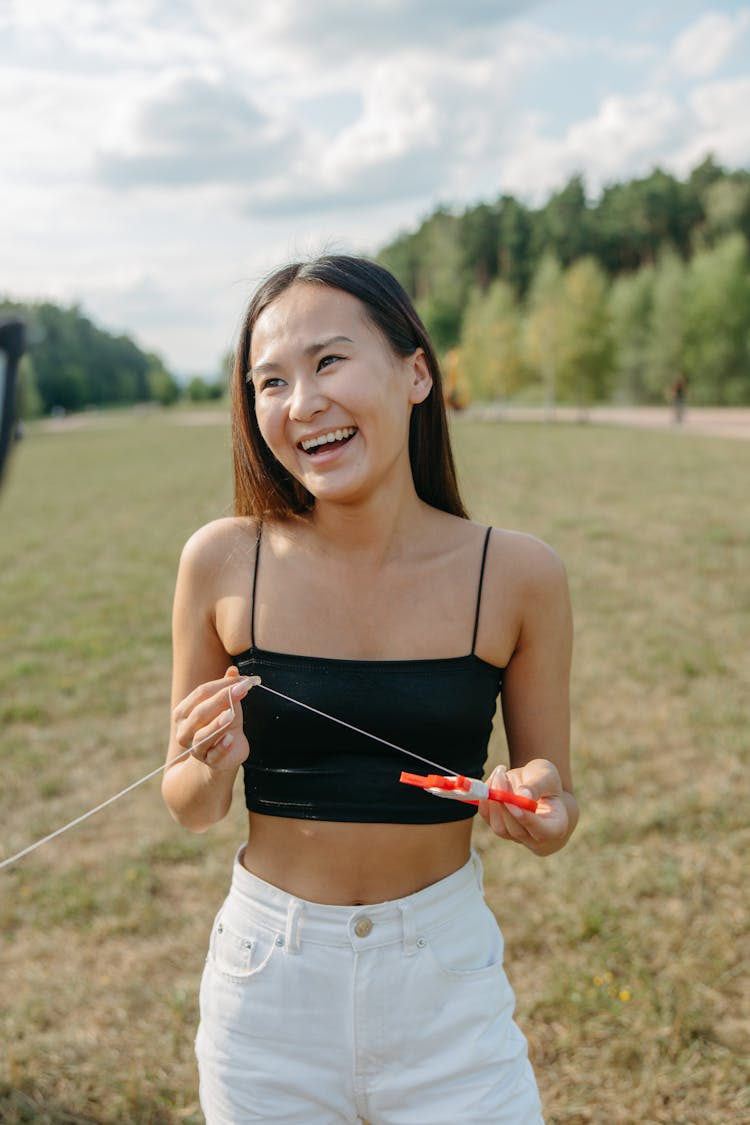 A Laughing Woman Wearing Black Tube Top