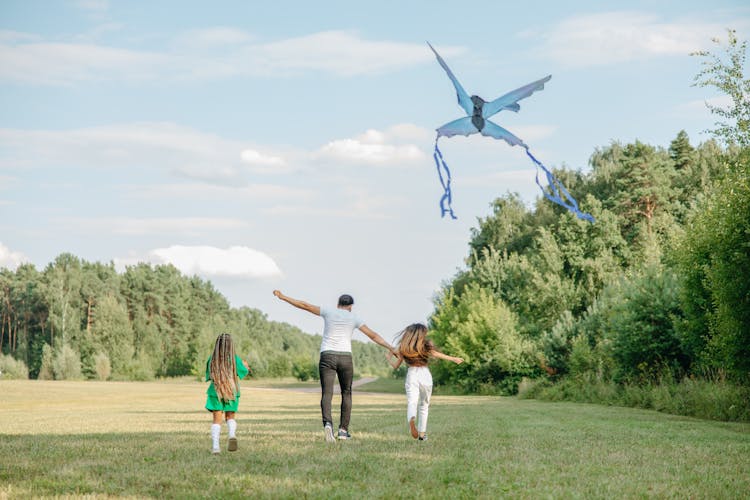 A Family Flying A Kite