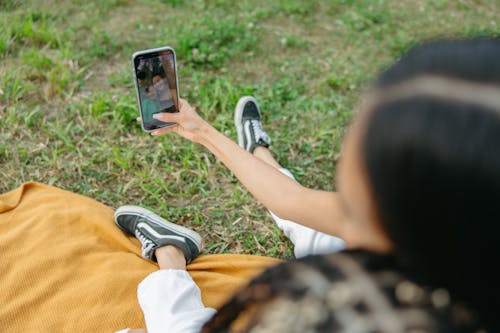 A Woman Taking Picture using a Smartphone