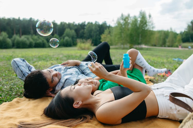 Woman Blowing Soap Bubbles