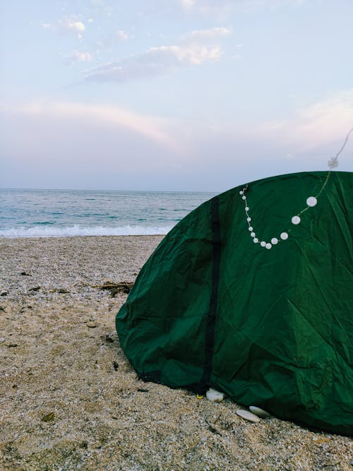 A Green Tent on the Beach