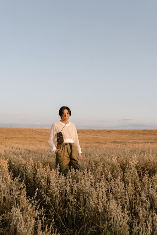 A Man Standing on the Dry Cropland