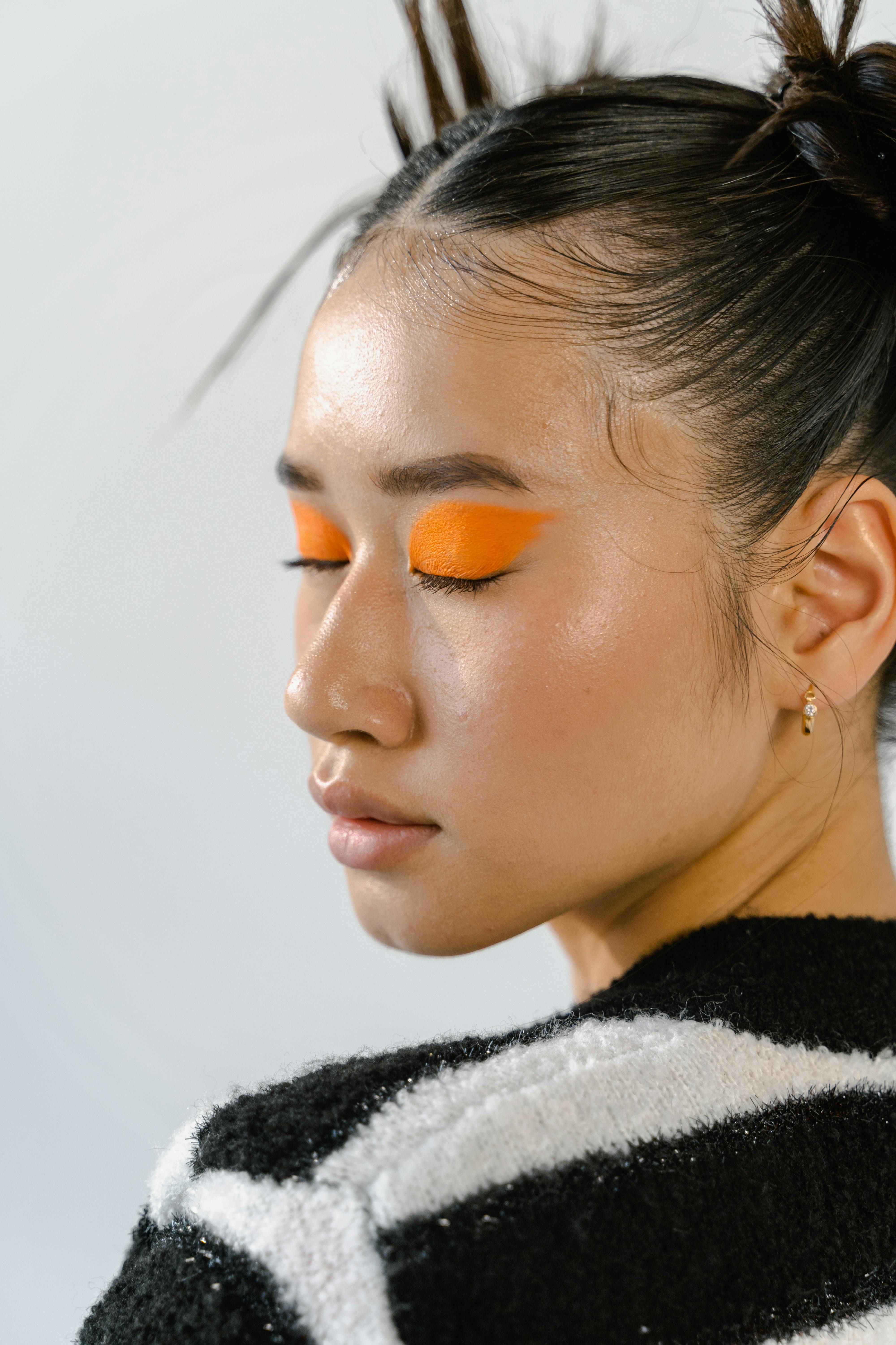 girl with orange eye makeup