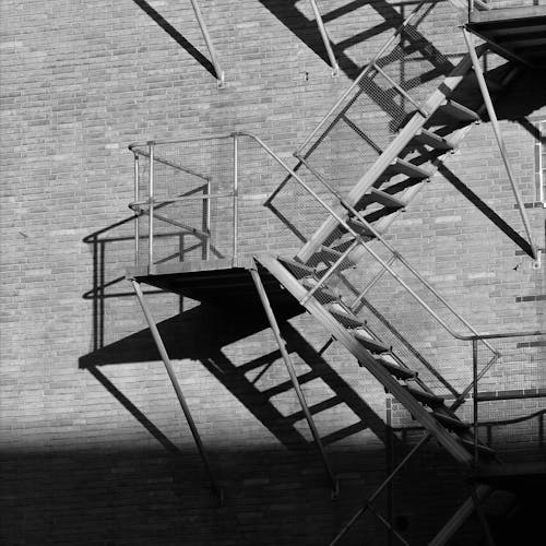 Free Grayscale Photo of Fire Escape Stairs Stock Photo