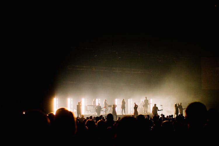 Silhouette Photo Of Music Band Playing On Stage