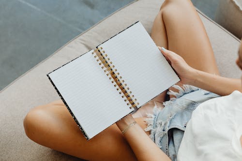 Person Holding a Notebook