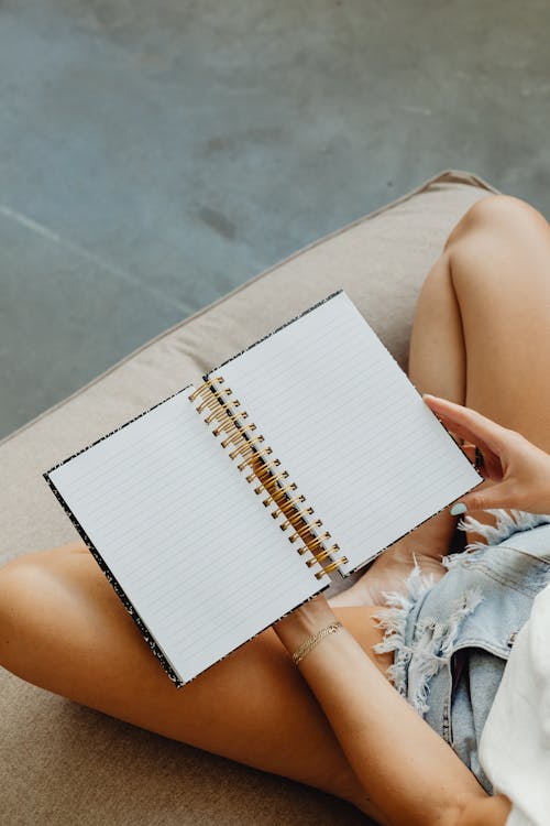 Person Holding a Notebook