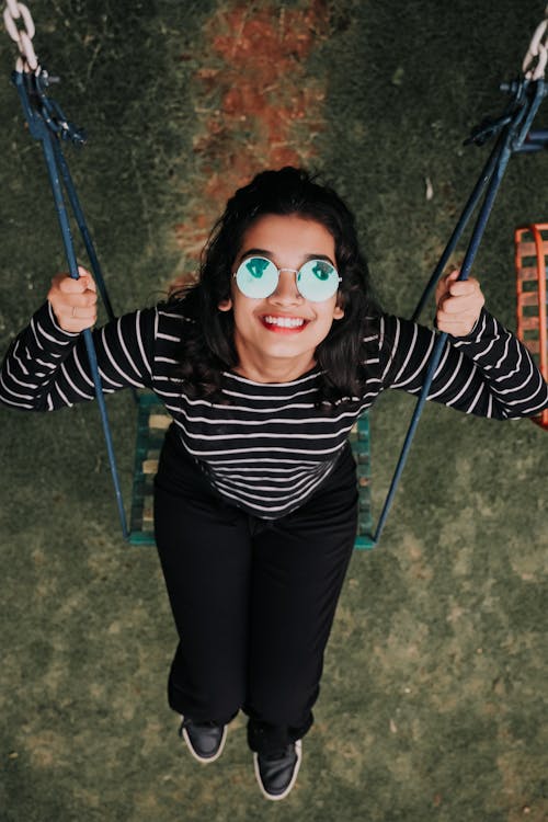 Free Woman on a Swing Stock Photo