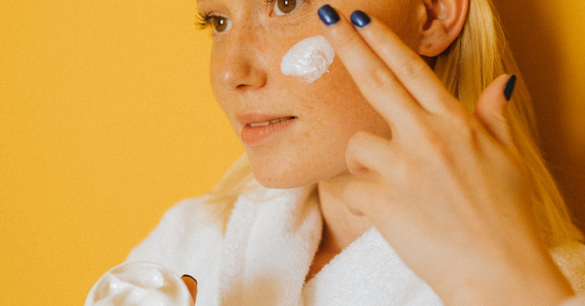 A model's face with bright and glowing skin after using Vitamin C serum.