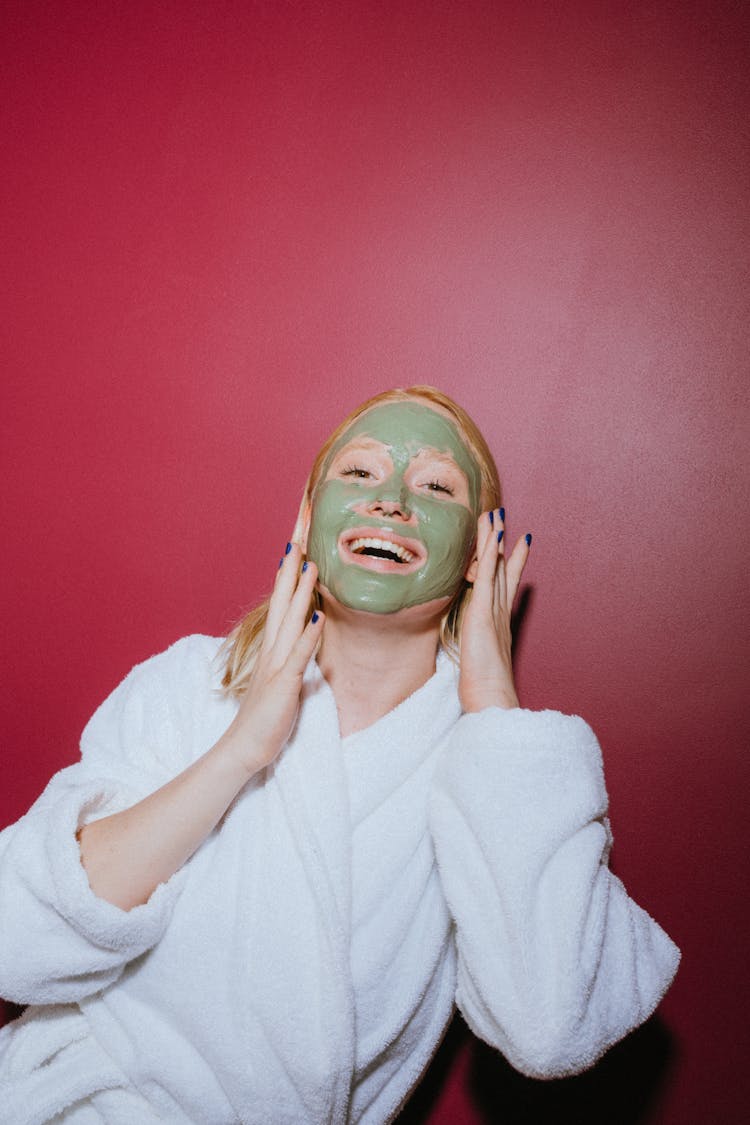 Woman Facial Cream Holding Her Face