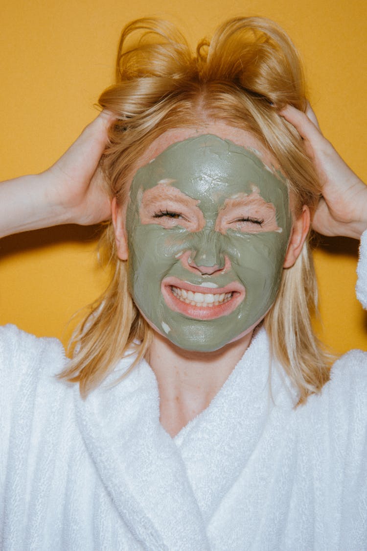 Woman In White Robe With Face Mask