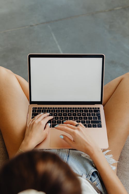 Free Woman Using a Laptop Stock Photo