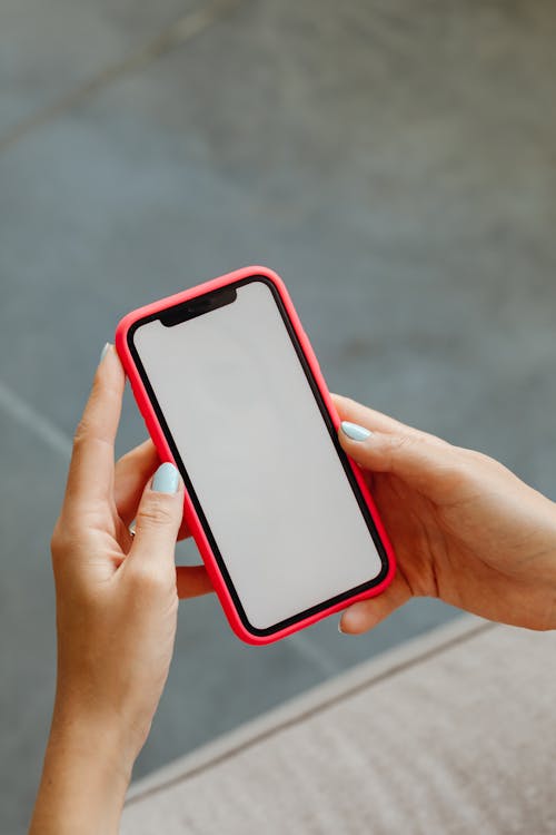 Person Holding a Red Smartphone