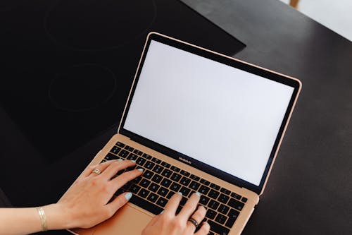 Person Typing on a Laptop