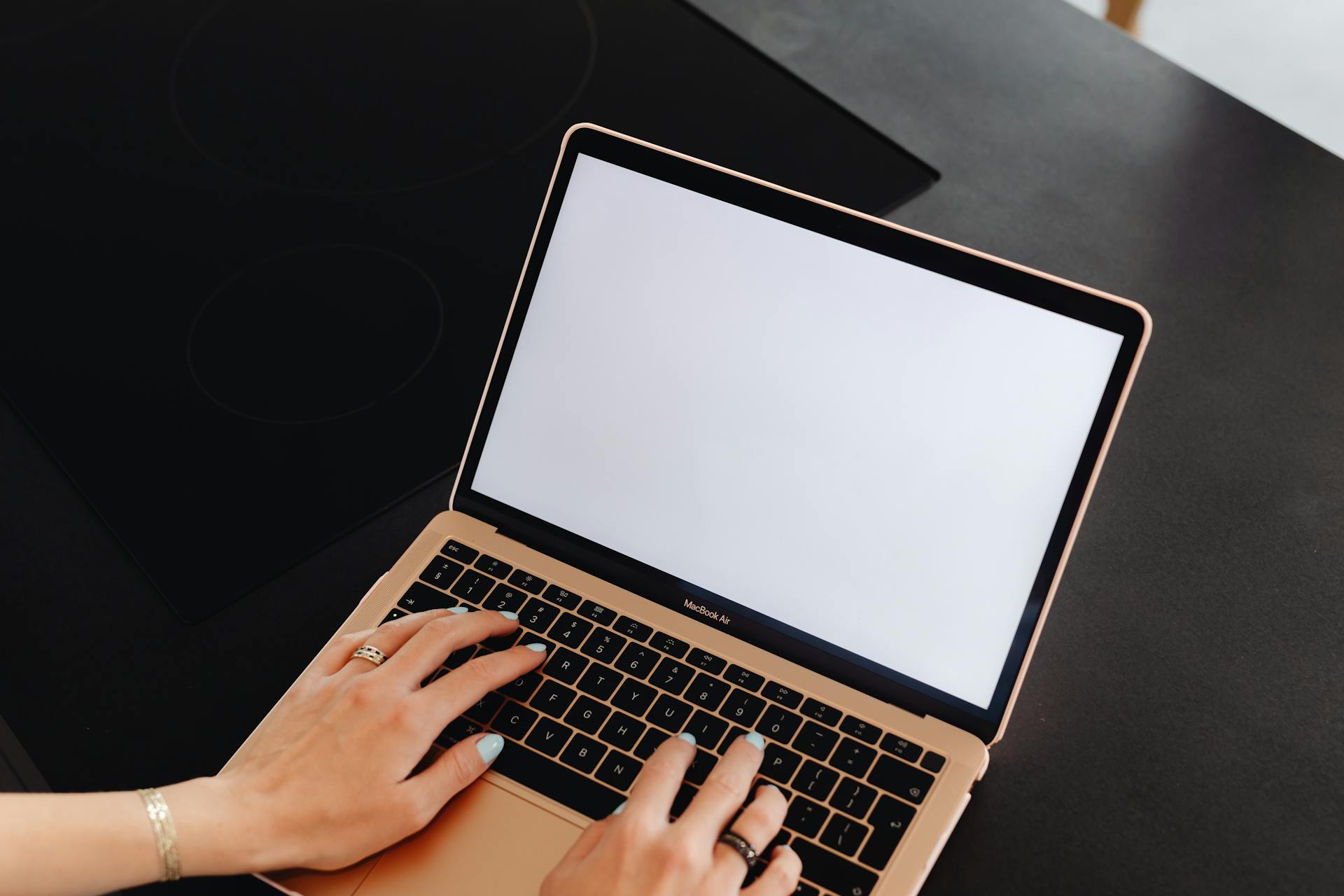 Person Typing on a Laptop