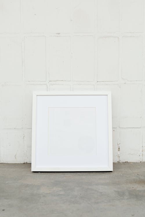 White Wooden Frame on Concrete Floor