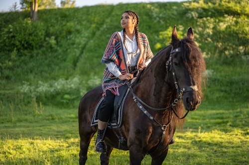Woman Riding a Brown Horse