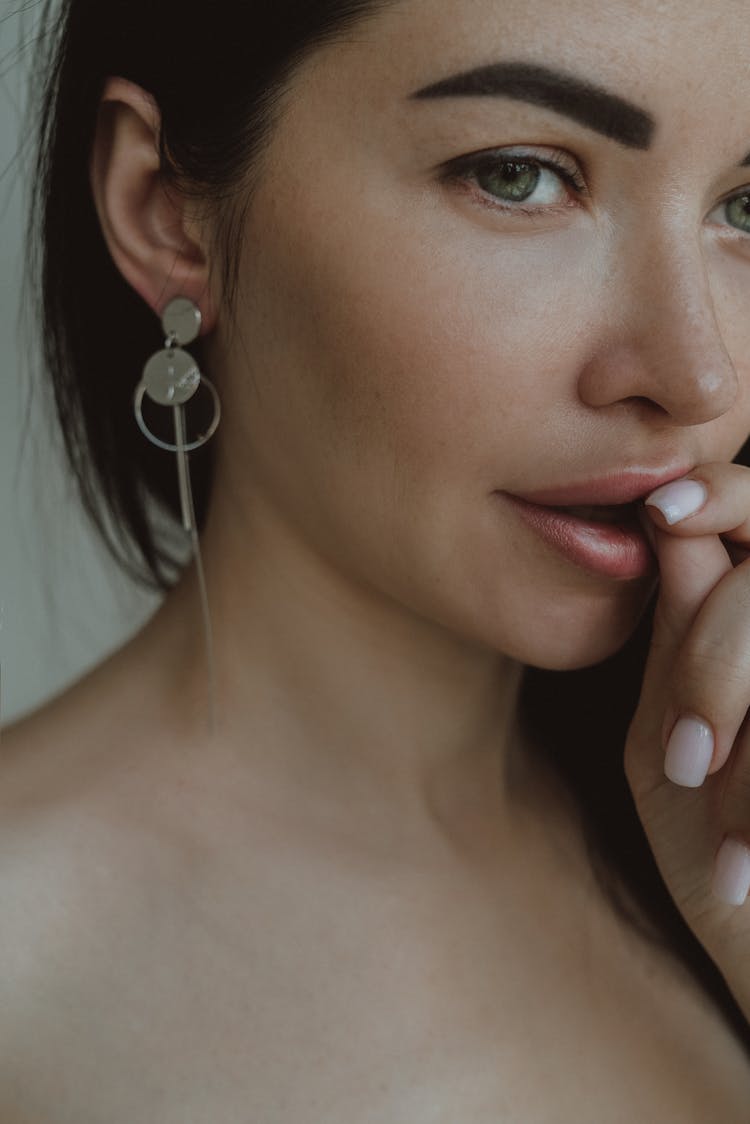 Woman Wearing A Silver Earring