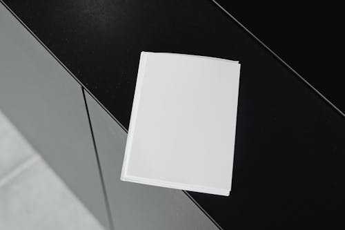 White Papers on Glass Table 