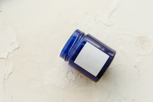 Blue Bottle in White Surface