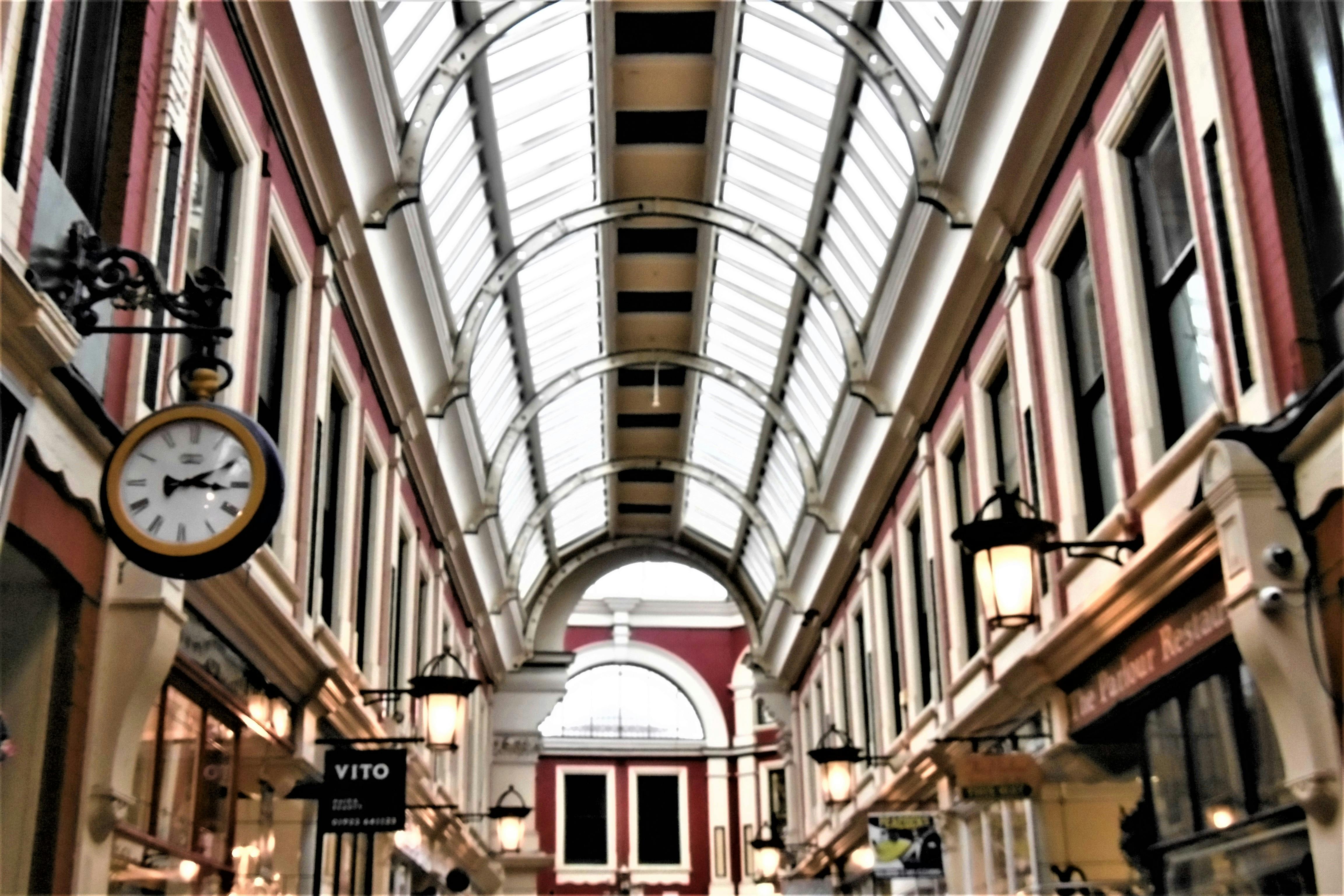 A person on a laptop researching rehabilitation facilities, with a notepad and pen for taking notes.