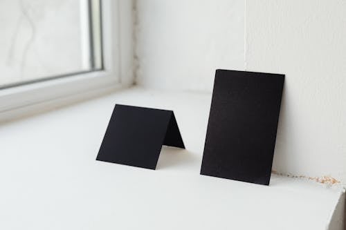 Black Papers on White Surface