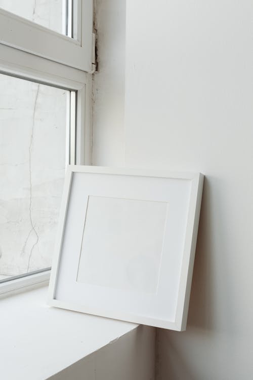 White Wooden Frame Near the Window